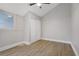 This bedroom offers neutral walls, wood floors, a ceiling fan and a closet at 2925 Wigwam Pkwy # 1021, Henderson, NV 89074