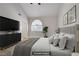 This virtually staged bedroom features a large window, neutral colors, and a modern design at 2925 Wigwam Pkwy # 1021, Henderson, NV 89074