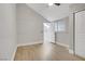 This bedroom offers neutral walls, wood floors, and a window to the outside at 2925 Wigwam Pkwy # 1021, Henderson, NV 89074