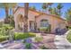 Charming single-story clubhouse with inviting arched entry and mature trees at 2925 Wigwam Pkwy # 1021, Henderson, NV 89074