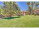 Expansive community lawn area with mature trees and well-maintained landscaping offers a serene and picturesque setting at 2925 Wigwam Pkwy # 1021, Henderson, NV 89074