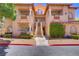 Attractive condo building featuring a well-maintained exterior, balconies, and landscaped grounds at 2925 Wigwam Pkwy # 1021, Henderson, NV 89074
