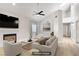 Bright living room features a fireplace, fan, and neutral-toned furniture for a cozy feel at 2925 Wigwam Pkwy # 1021, Henderson, NV 89074