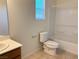 Bathroom with a shower-tub combo, toilet, and vanity with modern fixtures at 3165 Beltrada Ave, Henderson, NV 89044