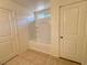 Bathroom featuring a tub-shower combo and neutral colored walls and tiled flooring at 3165 Beltrada Ave, Henderson, NV 89044
