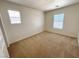Bedroom with plush carpeting and two windows offering natural light at 3165 Beltrada Ave, Henderson, NV 89044