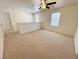 Large bonus room with neutral carpet and two windows at 3165 Beltrada Ave, Henderson, NV 89044