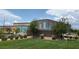 Contemporary building exterior featuring colorful panels and well-manicured landscaping at 3165 Beltrada Ave, Henderson, NV 89044