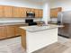 Spacious kitchen island with stainless steel appliances and wooden cabinetry at 3165 Beltrada Ave, Henderson, NV 89044