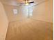 Bright and spacious bedroom featuring a ceiling fan and multiple windows at 3165 Beltrada Ave, Henderson, NV 89044