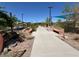Community playground with benches, shade canopies, and walking path at 3165 Beltrada Ave, Henderson, NV 89044