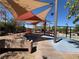 Fun playground with swings, slides, and shaded seating areas for children and families at 3165 Beltrada Ave, Henderson, NV 89044