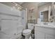 Clean and compact bathroom with a white vanity, shower, and toilet at 3195 Hazy Hills Ave, Henderson, NV 89052