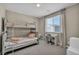 Cozy bedroom with gray bunkbeds, a window with blinds, and a built-in desk at 3195 Hazy Hills Ave, Henderson, NV 89052