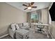 Cozy bedroom area with couch and desk setup and ceiling fan at 3195 Hazy Hills Ave, Henderson, NV 89052