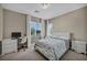 Bright bedroom features carpet, a large bed, desk and a ceiling light at 3195 Hazy Hills Ave, Henderson, NV 89052