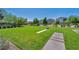 Expansive community park with lush green space, walking paths, and seating areas for relaxation at 3195 Hazy Hills Ave, Henderson, NV 89052