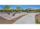 Community park featuring a playground, sand area, and walking paths at 3195 Hazy Hills Ave, Henderson, NV 89052