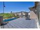 Enjoy neighborhood views from this deck, with black metal railings and outdoor chairs at 3195 Hazy Hills Ave, Henderson, NV 89052
