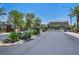 Elegant gated community entrance with mature landscaping and secured access at 3195 Hazy Hills Ave, Henderson, NV 89052