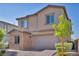 Charming two-story home showcasing a brick accent wall and a well-maintained front yard at 3195 Hazy Hills Ave, Henderson, NV 89052