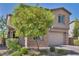 Beautiful two-story home with a brick facade and lush landscaping in a desirable neighborhood at 3195 Hazy Hills Ave, Henderson, NV 89052