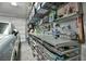 Organized garage with a workbench and ample storage solutions for tools and accessories at 3195 Hazy Hills Ave, Henderson, NV 89052