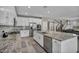 Modern kitchen boasts granite counters, stainless appliances, white cabinets, and an open layout for seamless entertaining at 3195 Hazy Hills Ave, Henderson, NV 89052