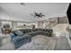 Open-concept living room with stairs and eating area nearby at 3195 Hazy Hills Ave, Henderson, NV 89052