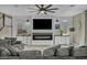 Cozy living room with plush seating and a modern fireplace at 3195 Hazy Hills Ave, Henderson, NV 89052