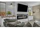 Charming living room features a modern fireplace, built-in cabinets, and wood-style accents at 3195 Hazy Hills Ave, Henderson, NV 89052