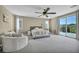 Spacious main bedroom with balcony access and a seating area at 3195 Hazy Hills Ave, Henderson, NV 89052