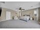 Large main bedroom with neutral tones and comfortable furniture at 3195 Hazy Hills Ave, Henderson, NV 89052