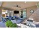 Inviting covered patio featuring a comfortable lounge area and outdoor dining space for relaxing entertainment at 3195 Hazy Hills Ave, Henderson, NV 89052