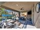 Relaxing patio with a view of the pool, outdoor seating and dining options at 3195 Hazy Hills Ave, Henderson, NV 89052