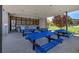 Covered picnic area with multiple picnic tables and barbecue grill, ideal for community gatherings at 3195 Hazy Hills Ave, Henderson, NV 89052