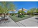 Community playground featuring slides, climbing structures, and shaded seating areas, perfect for Gathering fun at 3195 Hazy Hills Ave, Henderson, NV 89052