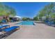 Enjoy the community pool with many lounge chairs on a bright day at 3195 Hazy Hills Ave, Henderson, NV 89052