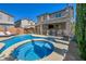 Inviting backyard pool and spa with a safety fence, perfect for outdoor entertaining and relaxation at 3195 Hazy Hills Ave, Henderson, NV 89052