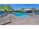 Community pool with crystal-clear water and poolside lounge area for relaxing at 3195 Hazy Hills Ave, Henderson, NV 89052