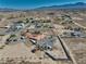 Expansive desert property featuring a single-story home, desert landscaping, and surrounding mountain views at 3251 S Parkridge Ave, Pahrump, NV 89048