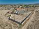 Sprawling property with mountain views, and fenced desert landscape at 3251 S Parkridge Ave, Pahrump, NV 89048