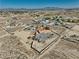 Large desert property with a single-story home, fenced yard, and panoramic views of the surrounding landscape at 3251 S Parkridge Ave, Pahrump, NV 89048