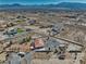 Single-story desert home with large fenced yard surrounded by an open landscape and distant mountain views at 3251 S Parkridge Ave, Pahrump, NV 89048
