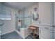 Bathroom showcasing a glass-enclosed shower, vanity area with a stool, and tiled flooring at 3251 S Parkridge Ave, Pahrump, NV 89048
