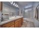 Bathroom featuring a vanity, countertop, toilet, and shower with sliding glass doors at 3251 S Parkridge Ave, Pahrump, NV 89048