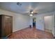 Comfortable bedroom with hardwood floors, a ceiling fan, and a closet, providing ample storage space at 3251 S Parkridge Ave, Pahrump, NV 89048