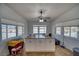 Bright bonus room with large windows, granite counters, and a ceiling fan, providing ample natural light at 3251 S Parkridge Ave, Pahrump, NV 89048