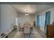 Dining room with a statement chandelier and blue curtains at 3251 S Parkridge Ave, Pahrump, NV 89048