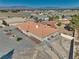 Desert home with a red tile roof, gravel landscaping, and fenced yard offering privacy and space at 3251 S Parkridge Ave, Pahrump, NV 89048